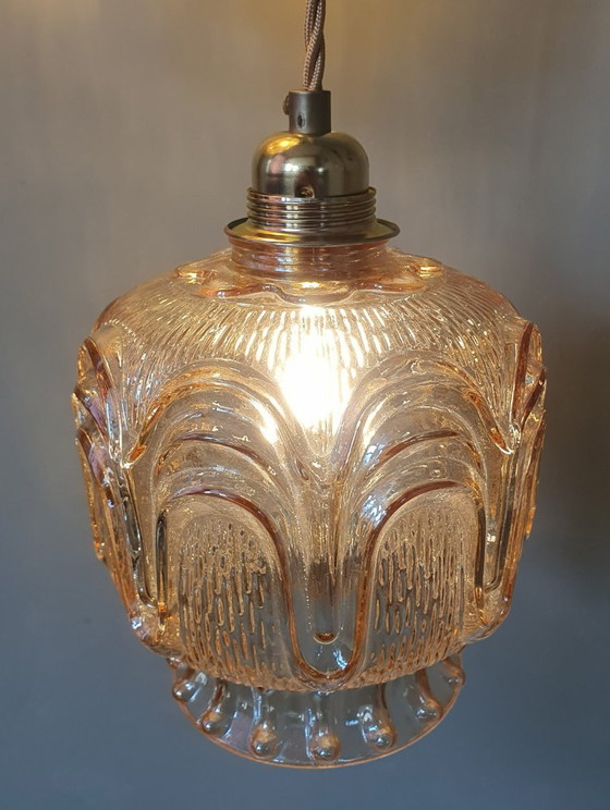 Image 1 of Set of 2 Vintage textured rose / amber tinted pendant lamps - mid-century design.