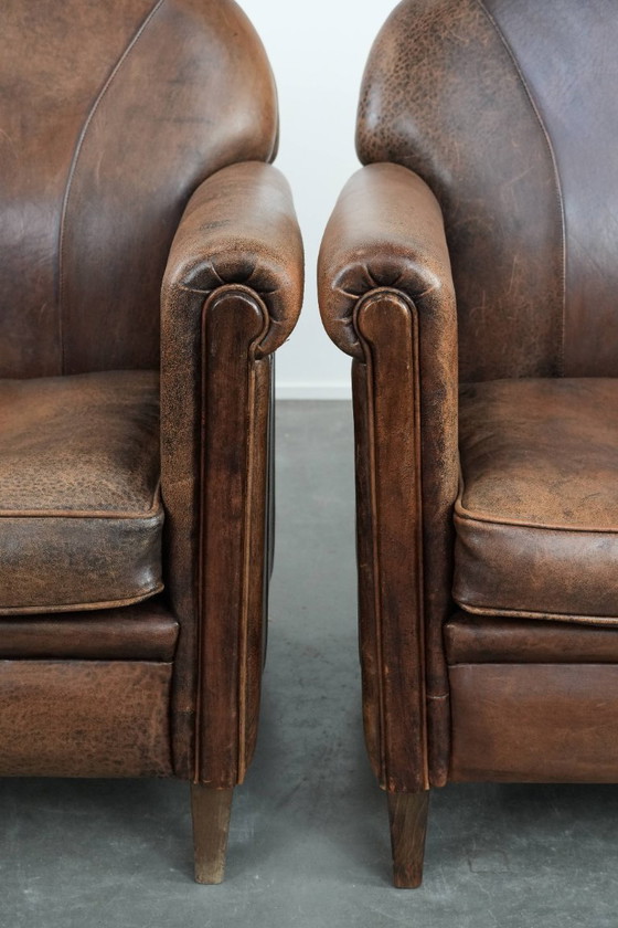 Image 1 of 2 x Vintage sheepskin armchair with warm colours and a characterful appearance