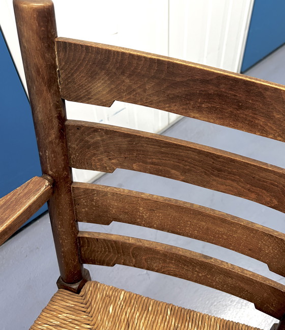 Image 1 of Antieke houten stoel met origineel strovlechtwerk.