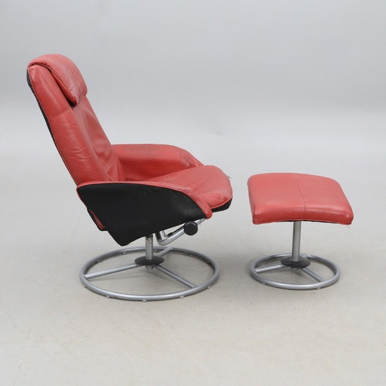 Image 1 of IKEA red leather armchair designed by K. Hagberg – M. Hagberg, from 2000–2010, with a tubular steel tripod base