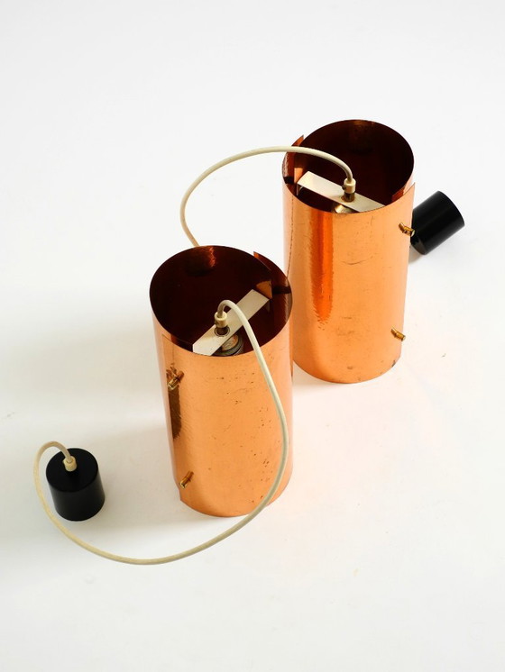 Image 1 of Two rare mid-century tube pendant lamps consisting of two screwed-together copper bowls