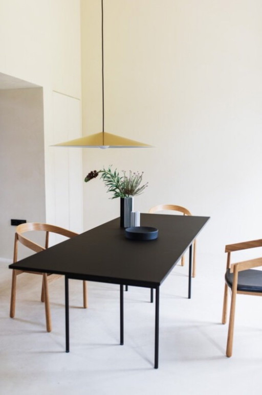 Dining table FÉST "Nude" from the "Nude dining tables" series - all-black execution