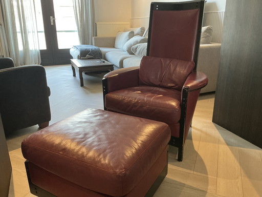 Giorgetti dark red leather chair with footstool