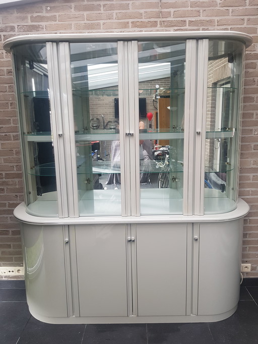 Display case with curved glass and lighting