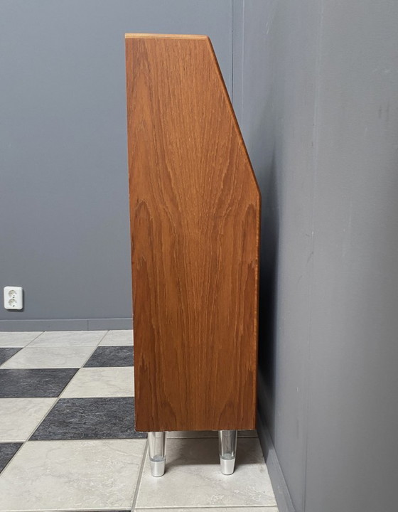 Image 1 of Teak tall sideboard on lucite legs 1960s