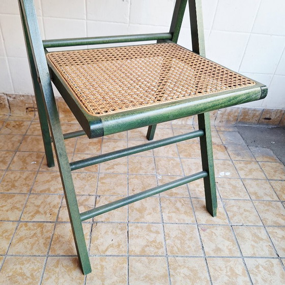 Image 1 of Sedia pieghevole vintage in legno con seduta in rattan