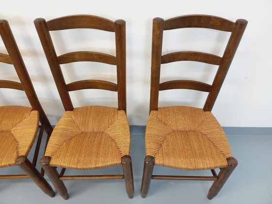Image 1 of Set van 4 vintage brutalistische stoelen van hout en stro uit de jaren 60.