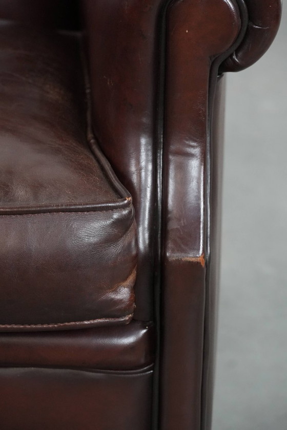 Image 1 of Donkere luxe schapenleren fauteuil/ armchair met een tijdloze uitstraling