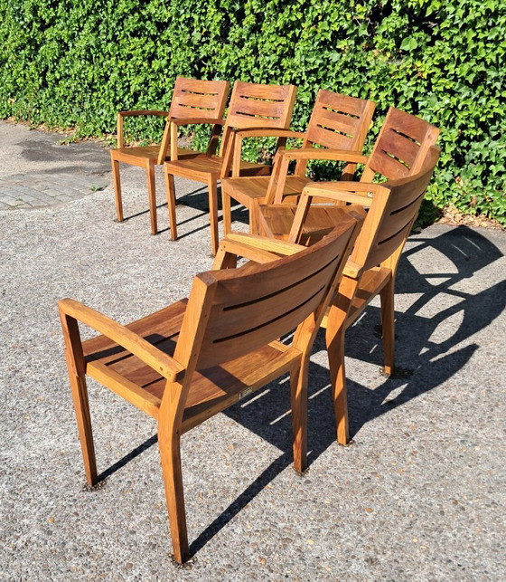 Image 1 of 6 Traditional Teak stacking chairs with armrests