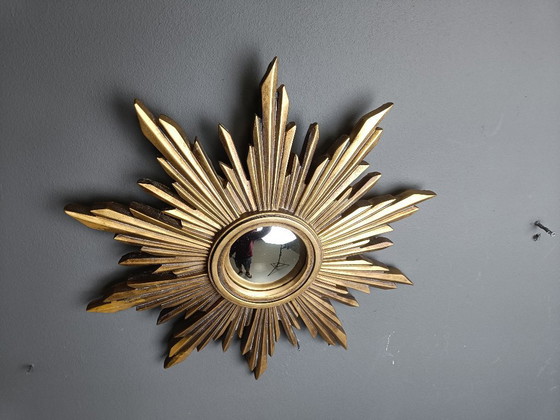 Image 1 of Beautiful resin sunburst mirror with convex mirror glass.  The golden mirror is in a good condition.  1960s - made in Belgium.  