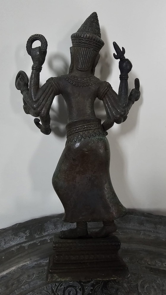 Image 1 of Heavy bronze Asian statue with multiple arms – sculptural statement