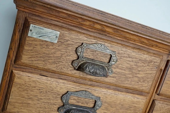 Image 1 of Antiker französischer Archiv-/Apothekerschrank aus Eiche von Chouanard, ca. 1910
