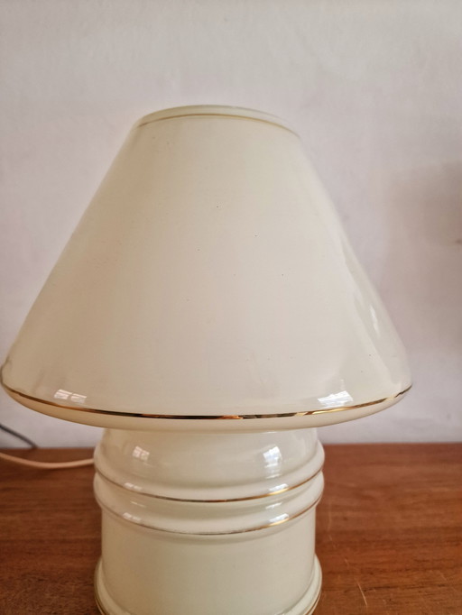 Vintage table lamp by Massive, with a glass base and shade.
With gold accents