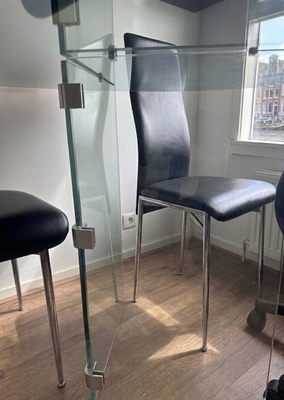 Image 1 of Oval smoked glass dining table