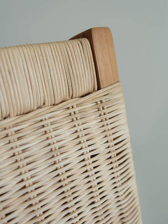 Image 1 of Poltrona lounge Valbona realizzata in teak massello e rattan intrecciato a mano.