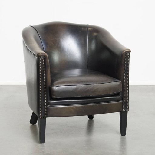 Black/gray club chair made of sheep leather
