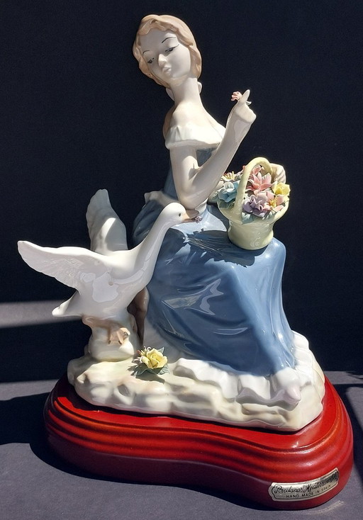 Large porcelain figurine: Lady with a goose and basket of flowers