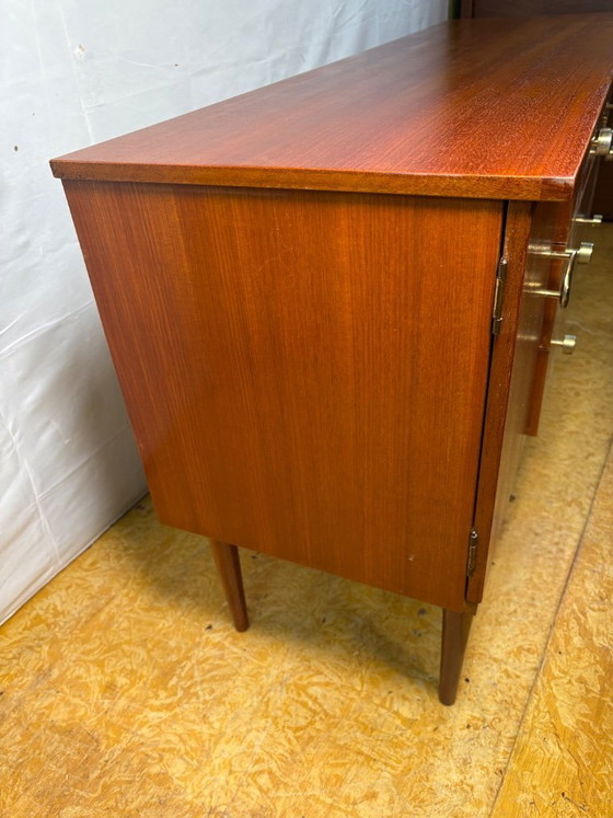 Image 1 of Mid Century Retro Teak Small Sideboard by Schreiber (Circa 1960)  A stylish and compact mid century modern teak sideboard by Sch
