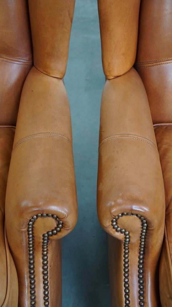 Image 1 of 2x Rundleren oorfauteuil afgewerkt met siernagels