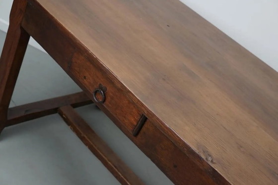Image 1 of Early 20th-century French rustic country dining table made of oak and elm