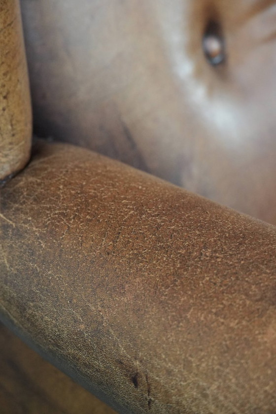 Image 1 of Sheepskin wing chair with a characterful appearance