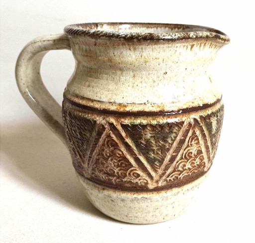 Stoneware pitcher stamped Giraud. Height 18.5 cm