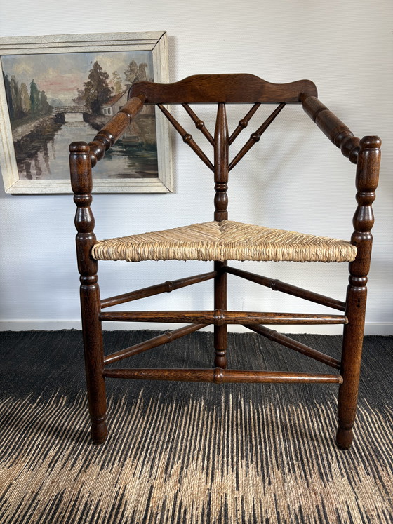 Image 1 of  Vintage Antiek 20ste eeuw eiken hoekstoel met biezen zitting h85cm