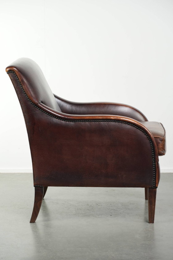 Image 1 of Poltrona di design in pelle di pecora in buone condizioni, con un bellissimo colore intenso e una seduta confortevole.
