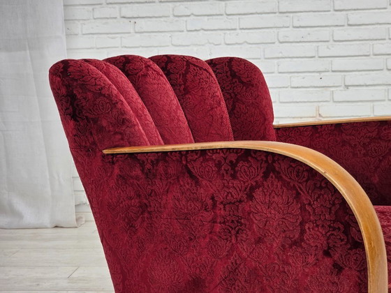 Image 1 of Anni '60, poltrona danese in velluto rosso ciliegia.
