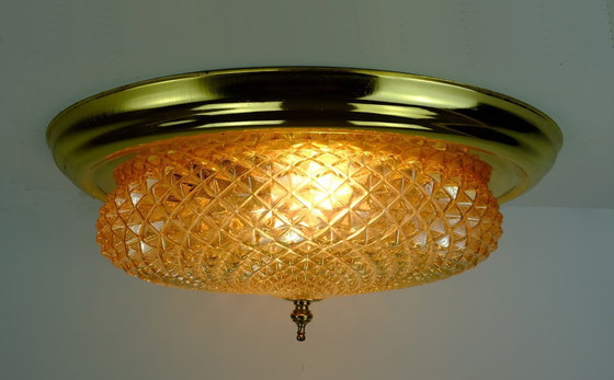 Image 1 of mid century ceiling LAMP flush mount textured amber glass and brass 1970s