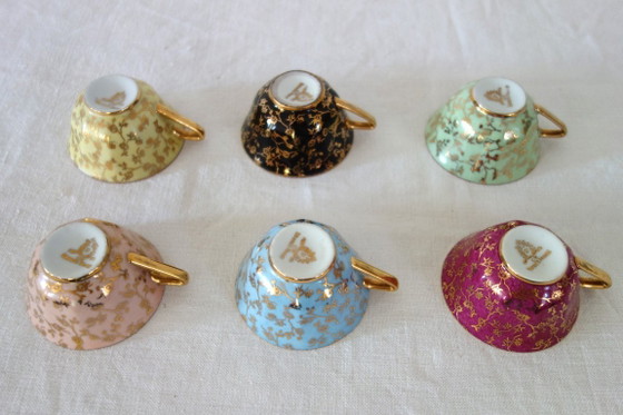 Image 1 of 6 vintage Limoges kopjes en schotels met bloem- en gouddecoratie.
