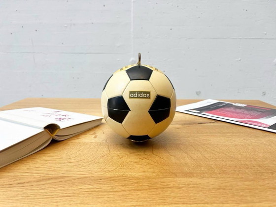 Image 1 of Vintage Adidas cigarette dispenser from the 1970s
