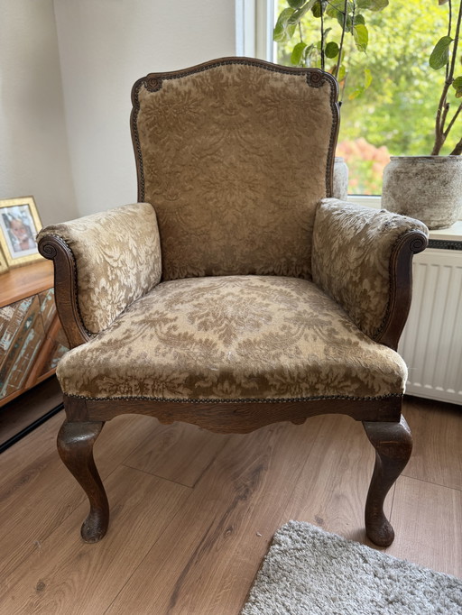 Vintage chair with floral motif, old-fashioned armchair
