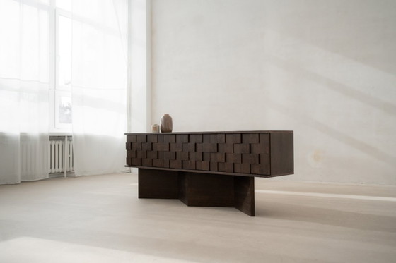 Image 1 of The Noemi chest of drawers is raw, minimalistic and uncompromising in its form.