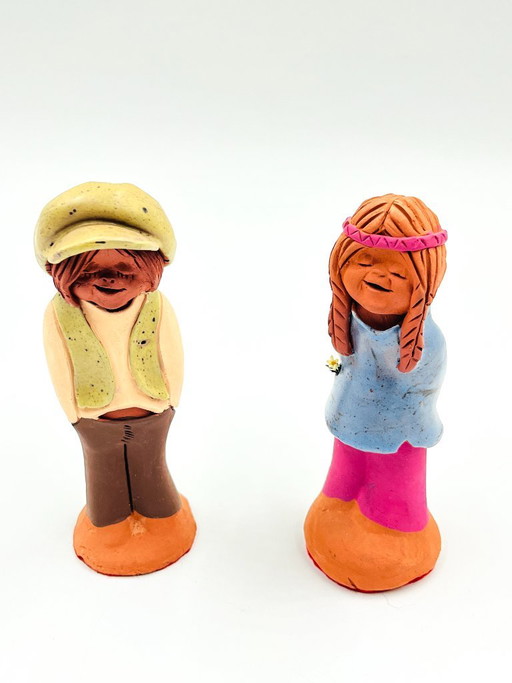 Two ceramic figurines, folk art style