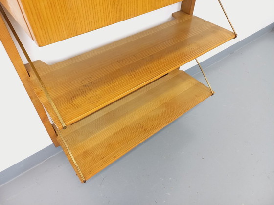Image 1 of Wall-mounted bookcase with vintage light wood and brass secretary bar, dating from the 1960s