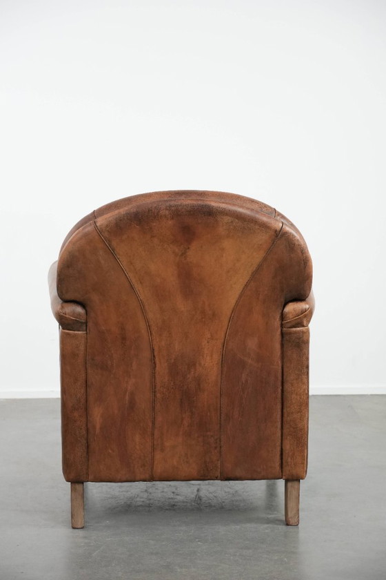 Image 1 of Vintage schapenleren fauteuil met een karaktervolle uitstraling
