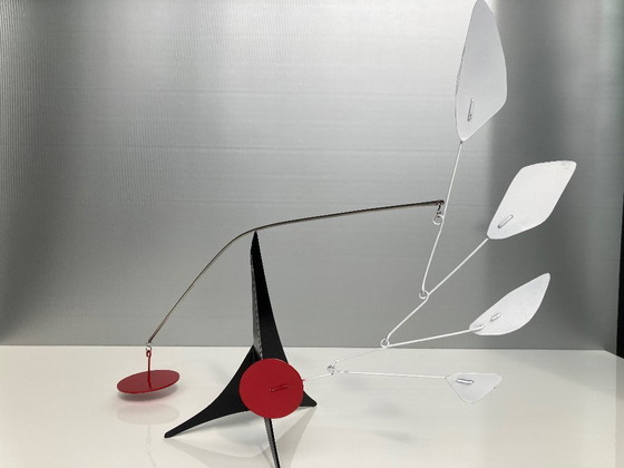 Image 1 of Black tripot, 4 leaves and a red disc