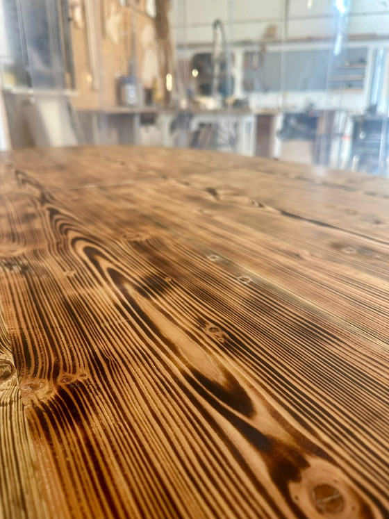 Image 1 of Oval dining table with burnt wood top