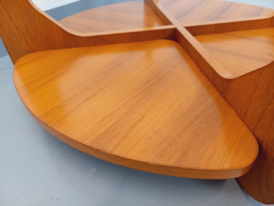 Image 1 of Vintage ronde salontafel met 2 bladen van Hugues Poignant, in teak en glas uit de jaren 60 en 70