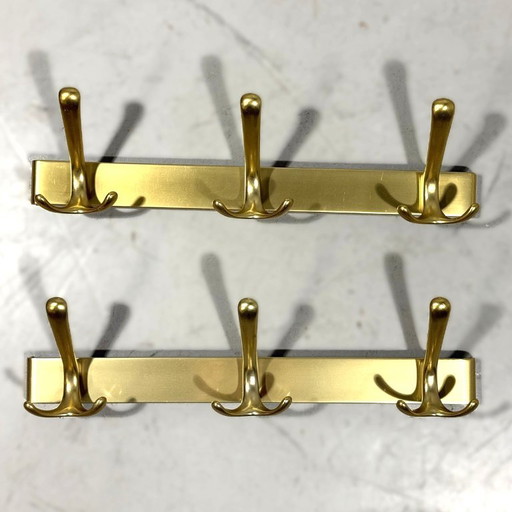 Goudkleurige aluminium wandkapstokken jaren 1960