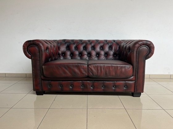 Image 1 of Chesterfield Sofa in Oxblood Leather – Fully Restored, Classic Design