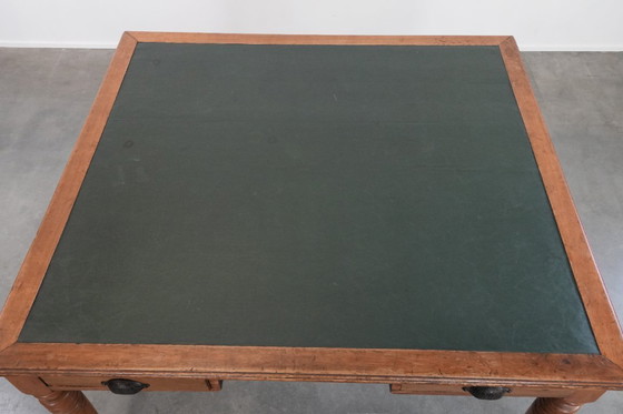 Image 1 of Antique writing table/partner desk with 4 drawers and a green leather top