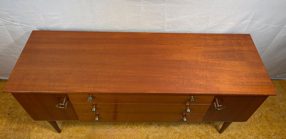 Image 1 of Mid Century Retro Teak Small Sideboard by Schreiber (Circa 1960)  A stylish and compact mid century modern teak sideboard by Sch
