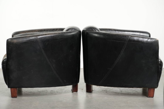 Image 1 of 2x rugged black vintage cowhide Aviator design armchairs with a distinctive look