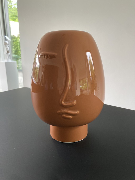 Modern brown vase with face
