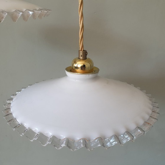 Image 1 of 2 vintage hanglampen van wit opaline glas met een transparante sierrand.