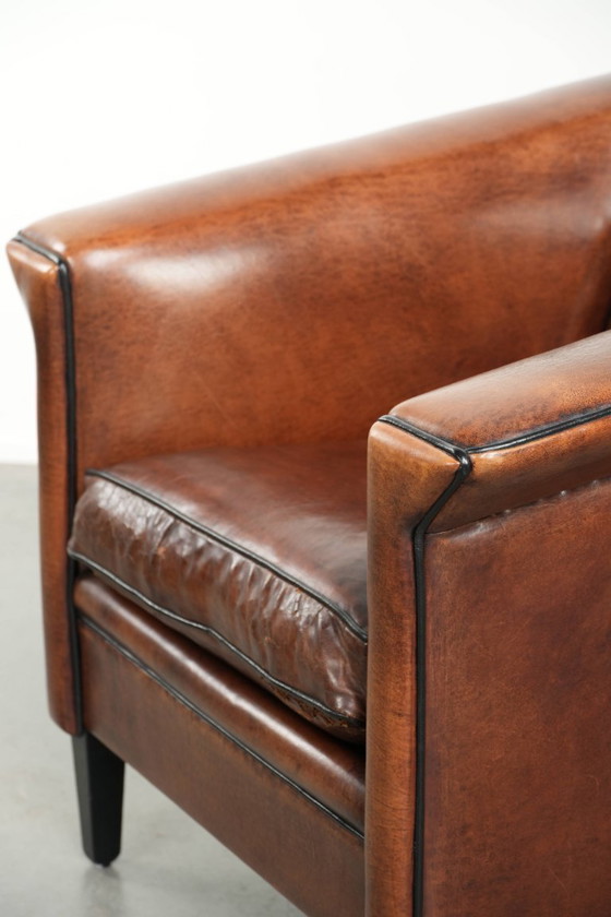 Image 1 of Sheepskin Art Deco design armchair with black piping