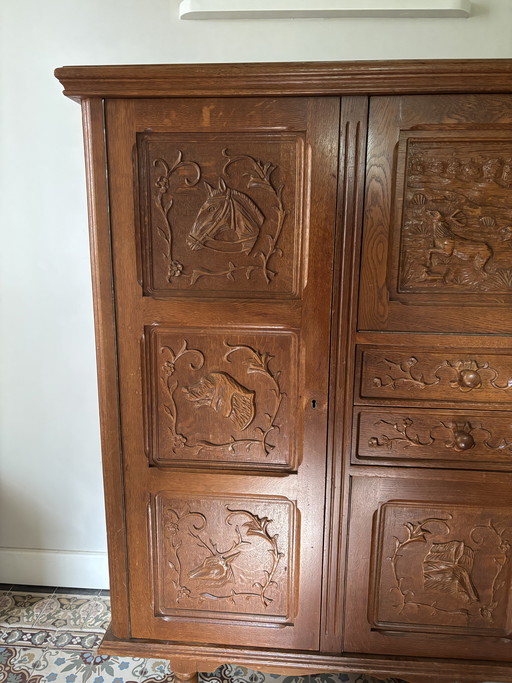 Antique oak secretary hunting cabinet with unique wood carving