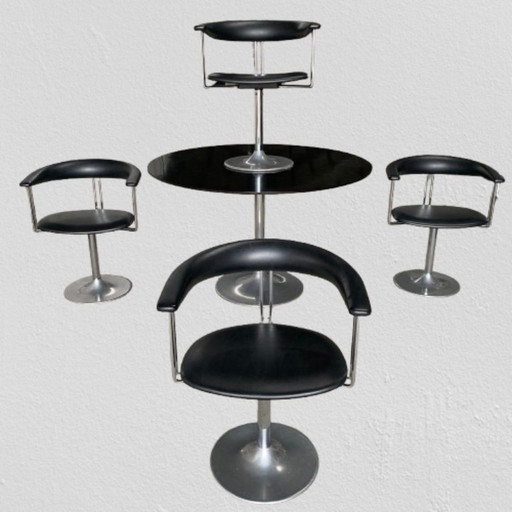 Tulip table and swivel chairs